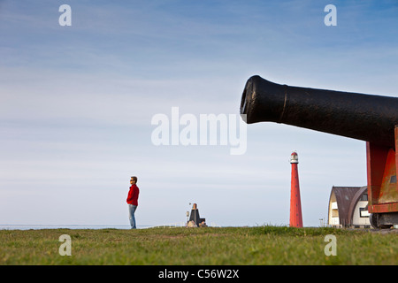 The Netherlands, Den Helder, lighthouse and cannon. Stock Photo