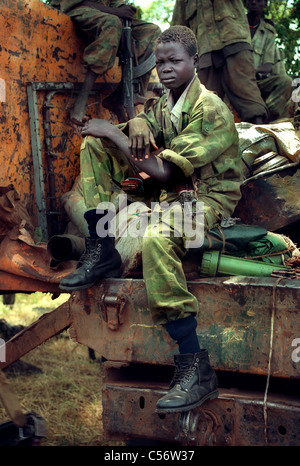 12 year old South Sudanese child soldier, member of the Sudan People's Liberation army, on front line duty whilst fighting North Sudanese army in Southern Sudan, Africa Stock Photo