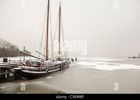 The Netherlands, Hoorn, harbour for traditional sailing boats. Winter, snow. Stock Photo