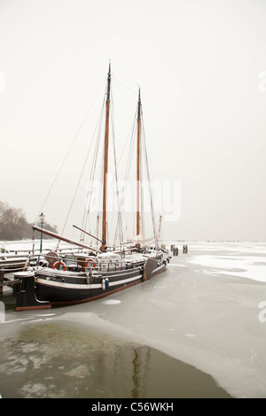 The Netherlands, Hoorn, harbour for traditional sailing boats. Winter, snow. Stock Photo