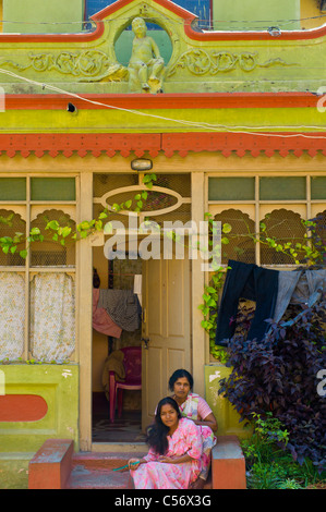 Mother and daughter in front of their home, Mysore, Karnataka, India. Stock Photo