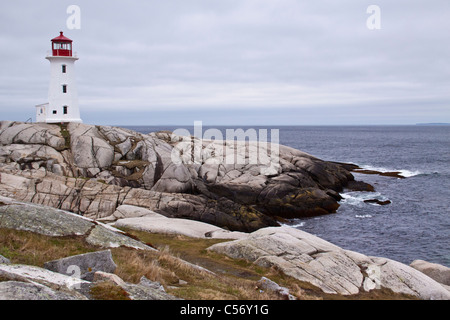 Peggy's Point Lighthouse on a stormy day in May at Peggy's Cove near Halifax, Nova Scotia, Canada. Stock Photo