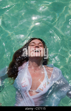 Woman swimming in tropical sea Stock Photo