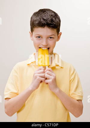Boy eating a popsicle Stock Photo