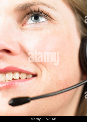 Close up of woman wearing headset Stock Photo