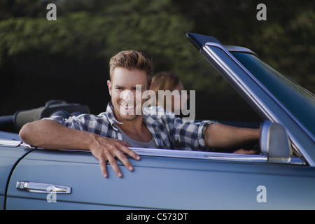 Man driving convertible Stock Photo