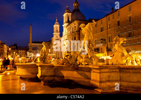 Twilight in Piazza Navona with the Fountain of Neptune and Chiesa di Sant Agnese beyond, Rome Lazio Italy Stock Photo