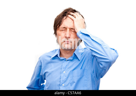 Young businessman looking anxious and worried, having a headache Stock Photo