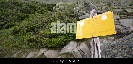 Yellow warning sign along the Appalachian Trail in the White Mountains, New Hampshire USA Stock Photo
