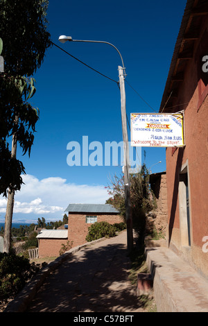 A store and buildings on the Island of Amantani. Amantani is an island on Lake Titicaca in Peru. Stock Photo