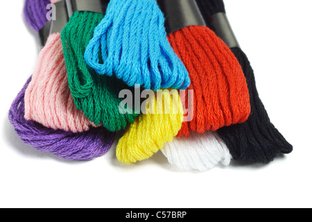 Close up of colorful embroidery threads on white background Stock Photo