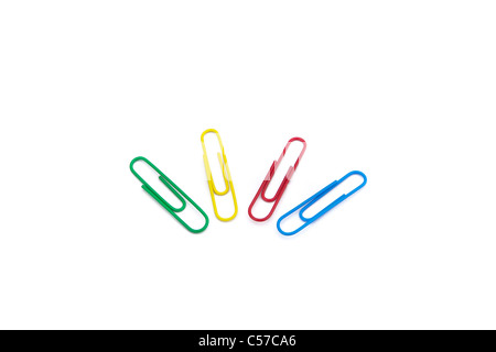 four colored paper clips on white background Stock Photo
