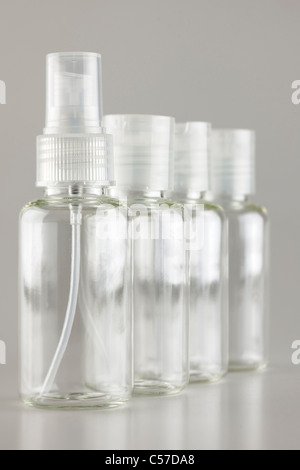 Four refillable plastic travel bottles Stock Photo