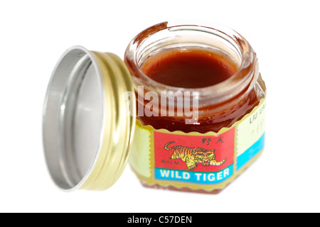 Opened small jar of Wild Tiger balm. Stock Photo