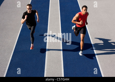 Runners racing on track Stock Photo