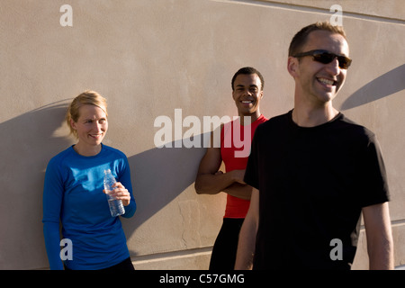 Friends talking after running together Stock Photo