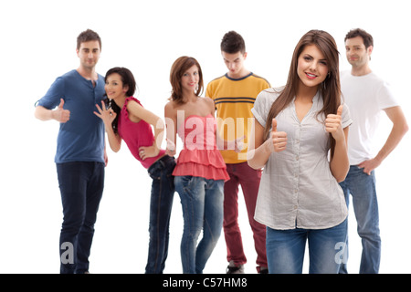 smiling woman showing ok sign, posing in front of approving group Stock Photo