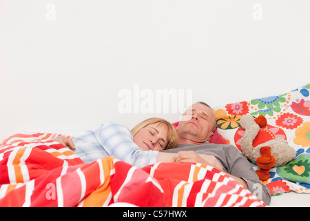 Couple asleep in bed Stock Photo