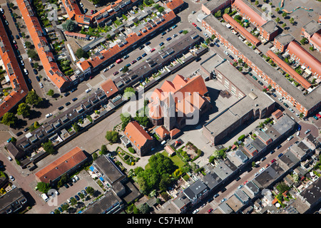The Netherlands, Utrecht, View on church in residential district. Aerial. Stock Photo