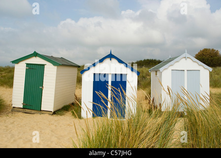 Brightly colored huts on beach Stock Photo