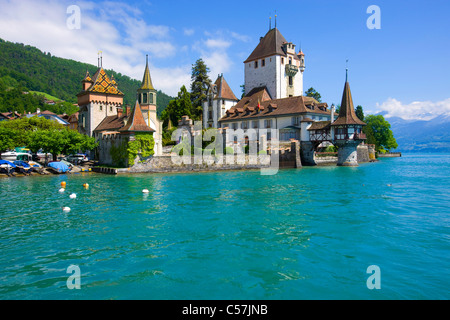 Oberhofen, Switzerland, Europe, canton Bern, lake, sea, lake of Thun, castle, lock, clouds Stock Photo