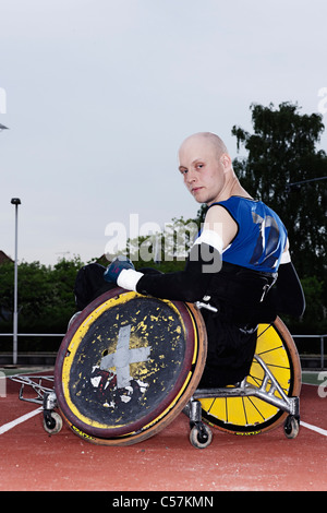 Para rugby player in wheelchair on track Stock Photo