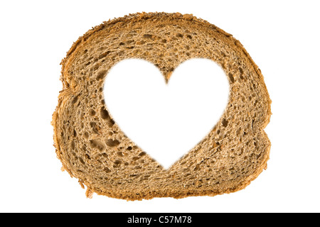 Heart shaped hole in a slice of bread, isolated on white Stock Photo