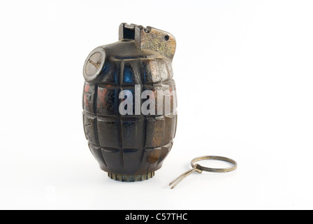 An authentic WWII era hand grenade with pin pulled out isolated on a white background. Stock Photo