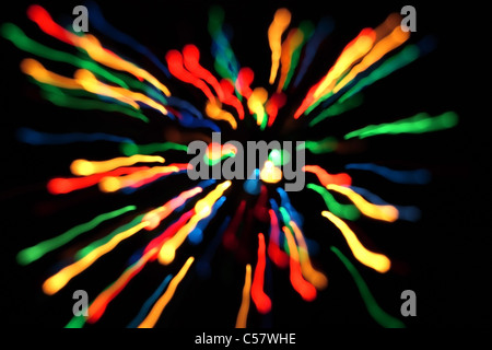 Multicolored streaks of light against a black background Stock Photo