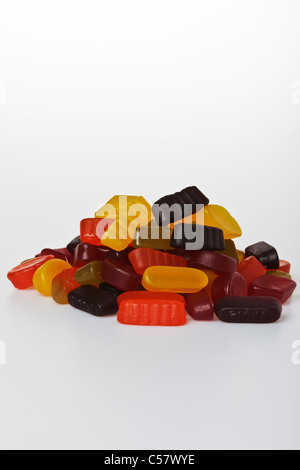 Pile of wine gums against a plain white background Stock Photo