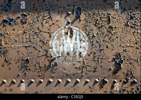 Faded Great Western Railway logo on the side of a rusting railway vehicle Stock Photo