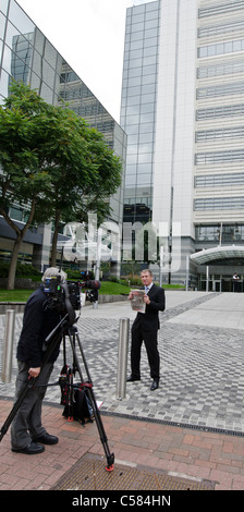 James Doyle BBC TV news journalist holding last copy of The News of The World News International building Thomas More Square Stock Photo