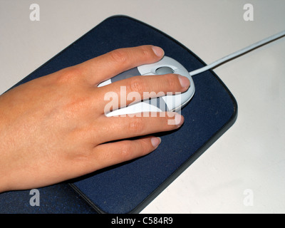 Hand on Computer Mouse and Mouse Mat Stock Photo