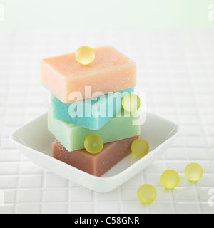 Close-up of bars of soap in bowl Stock Photo