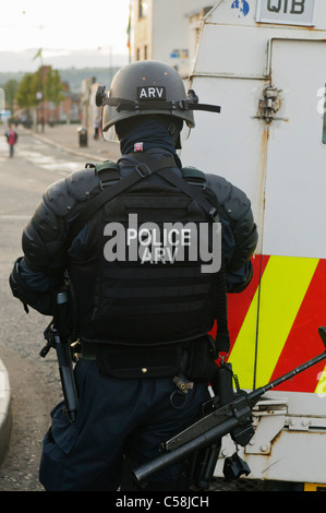 Police officer in riot gear with a Heckler and Koch L104A1 37mm single-shot AEP launcher Stock Photo