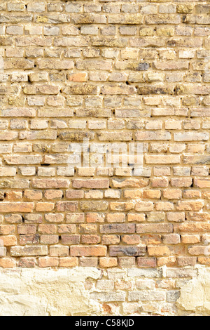 old weathered brick walls with crumbling plaster Stock Photo