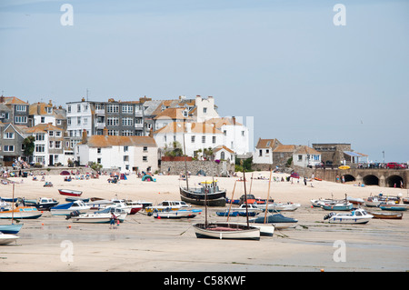 St Ives harbour at low tide with sailing boats beached on the sandy shore. Cornwall, England, UK. ( muted tones ) Stock Photo