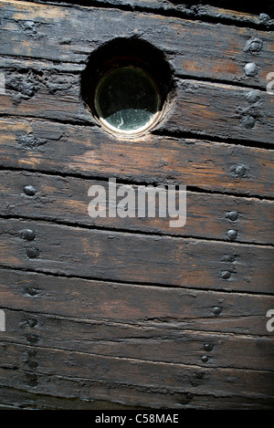 Hull boarding of an old wooden steam ship . Boards treated with tar against wear and pitch used to seal the slits between boards , Finland Stock Photo