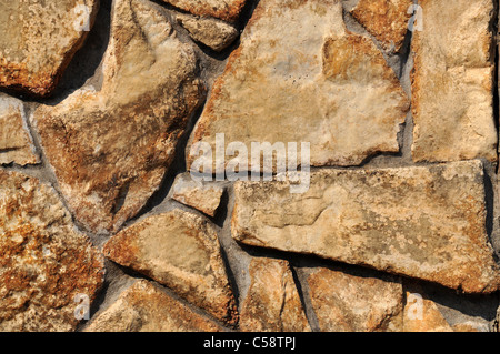 A close up section of a stone wall that can be used for a textured background. Stock Photo