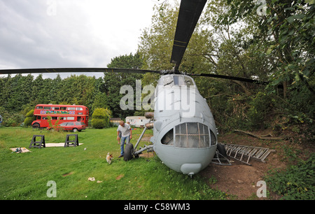 Tim Johnson has recently bought an old Westland Search and Rescue helicopter which he is converting into a caravan to rent out Stock Photo