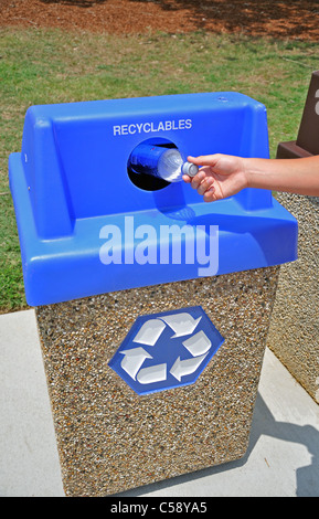 A person recycles a #1 soda pop bottle Stock Photo
