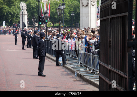 British policemen observes the crowd of spectators during the Trooping the Color ceremony in London Stock Photo