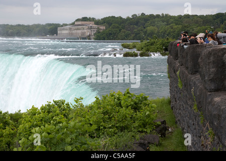 tourists taking photos of the horseshoe falls niagara falls ontario canada Stock Photo