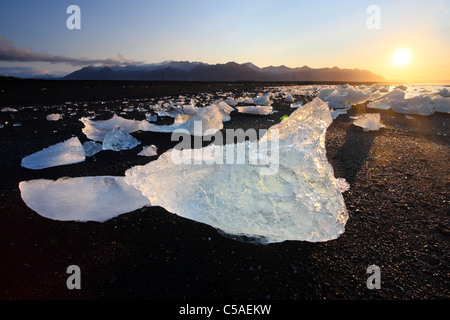 Big chunks of Glacier Ice on Black Sand Beach, Jökulsárlón, Iceland. Stock Photo