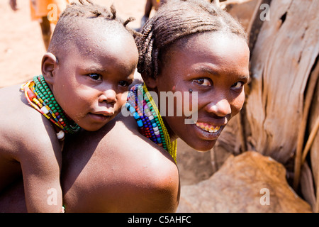 Galeb or Dassanech woman and child at a village in the Lower Omo Valley, Ethiopia Stock Photo