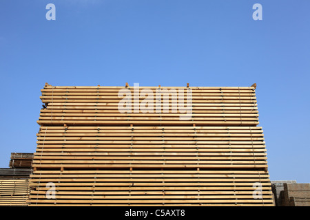 Stack of boards in lumber yard Stock Photo