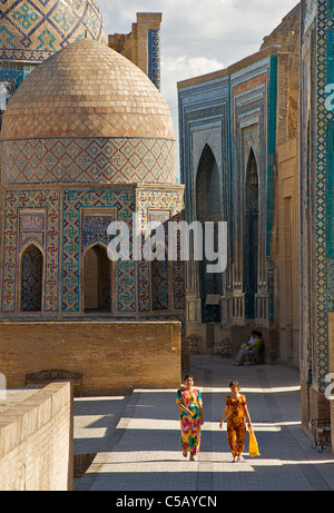 Uzbeki women in colourful attire, Shahr i Zindah mausoleum, Samarkand, Uzbekistan Stock Photo