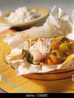 Bream filet in grease - proof paper Stock Photo