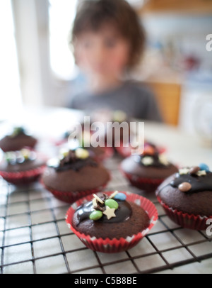 Child with homemade cupcakes Stock Photo