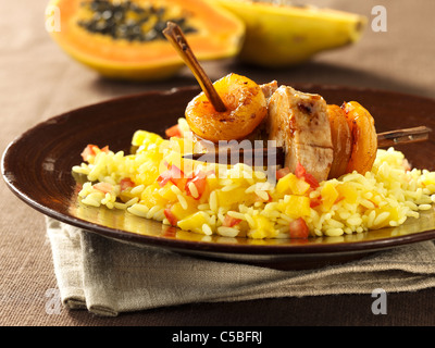 Marinaded pork fillet on spits with apricots (Sosaties) with spicy rice Stock Photo